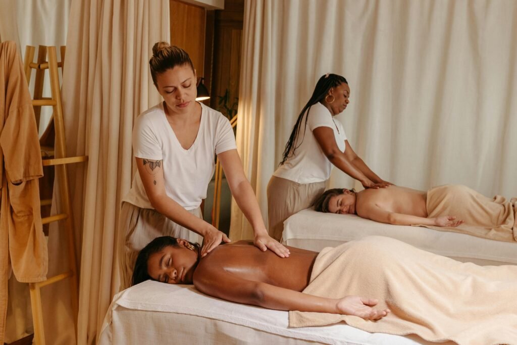Women receiving soothing massages in a cozy spa for relaxation and stress relief.